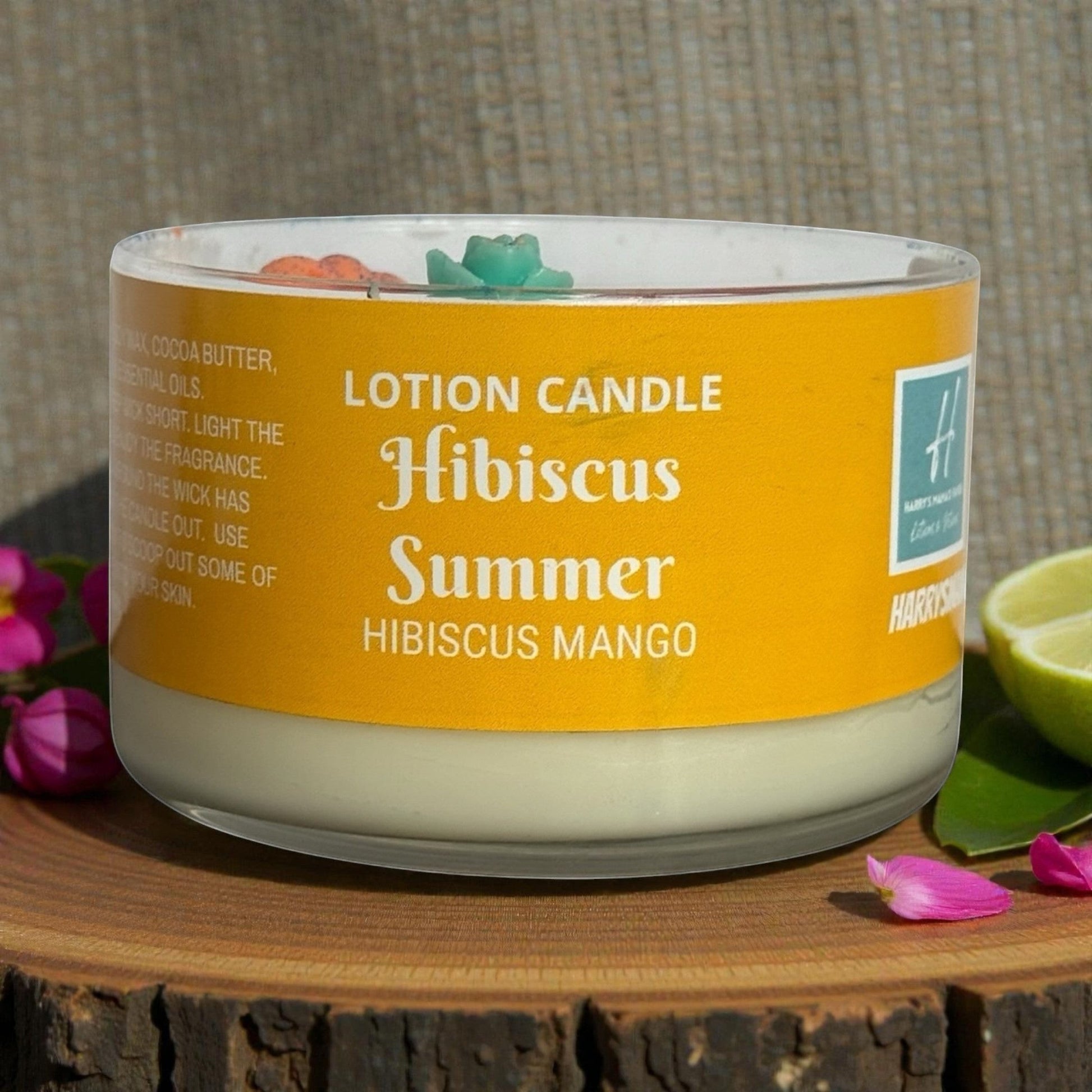 Harry’s Mama’s Faves: Lotions & Potions Hibiscus Summer lotion candle in glass vessel with yellow label, melts into lotion.