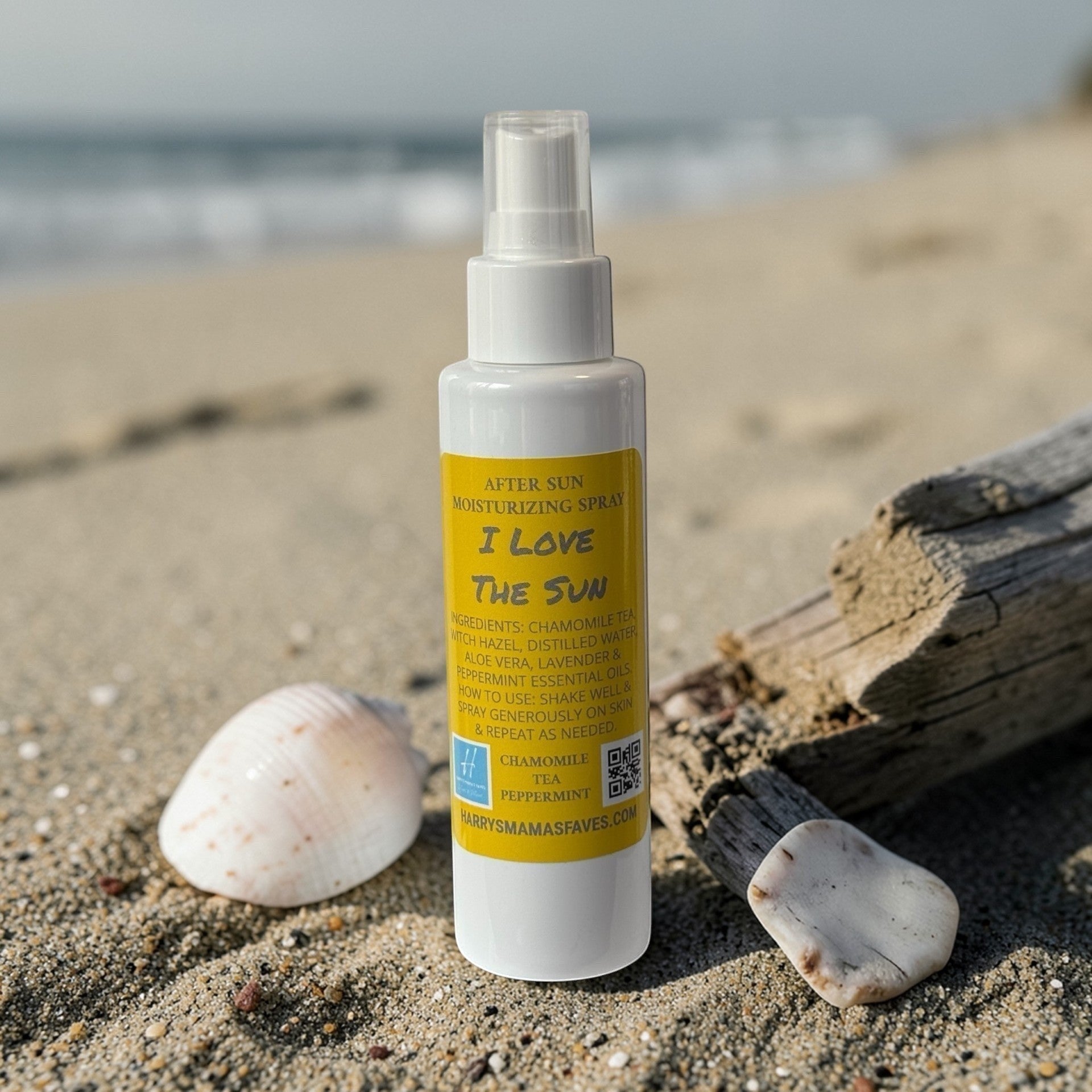 Harry’s Mama’s Faves: Lotions & Potions after sun moisturizer spray bottle on a sandy beach with seashells.