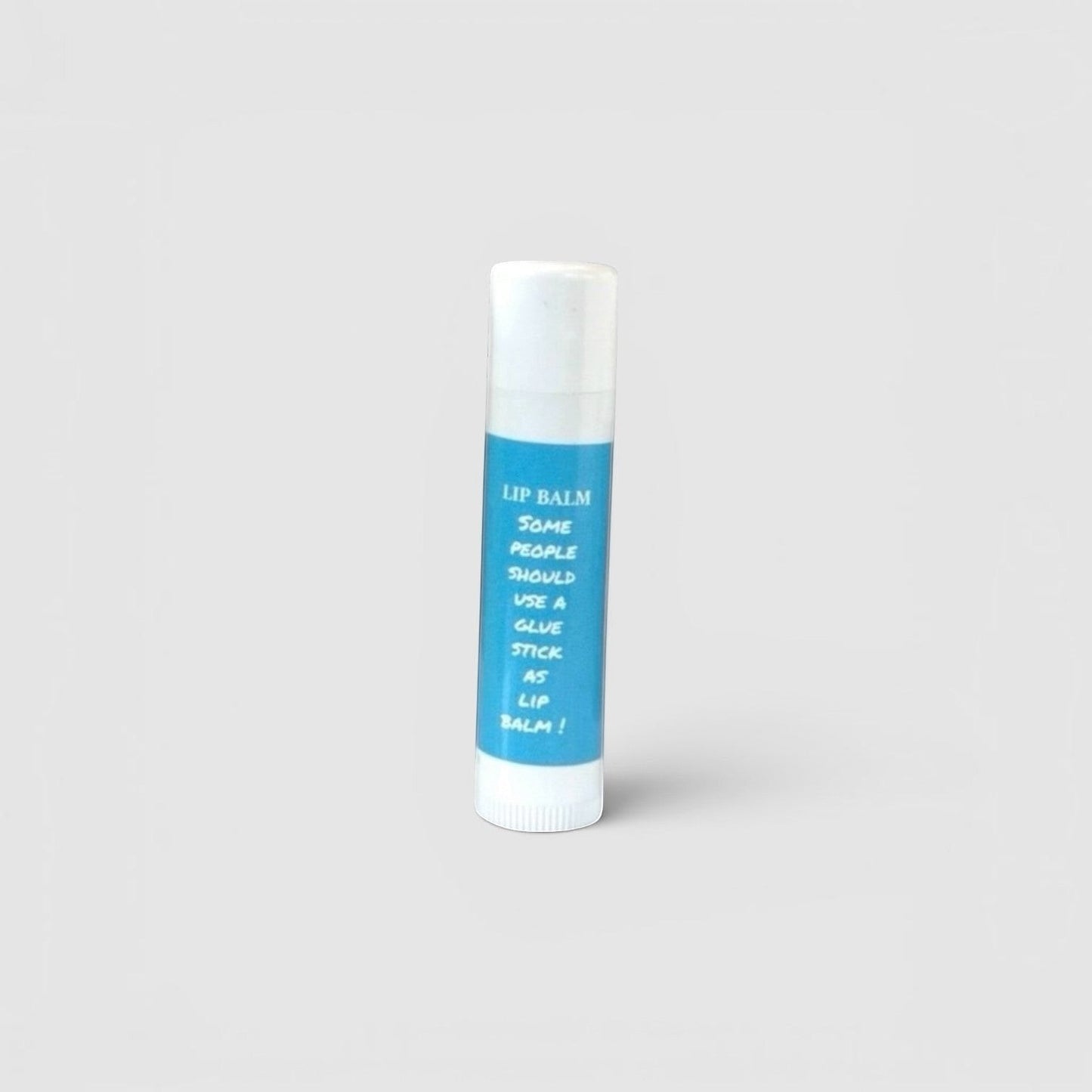 Harry’s Mama’s Faves: Lotions & Potions moisturizing lip balm in a blue tube with a humorous glue stick design.