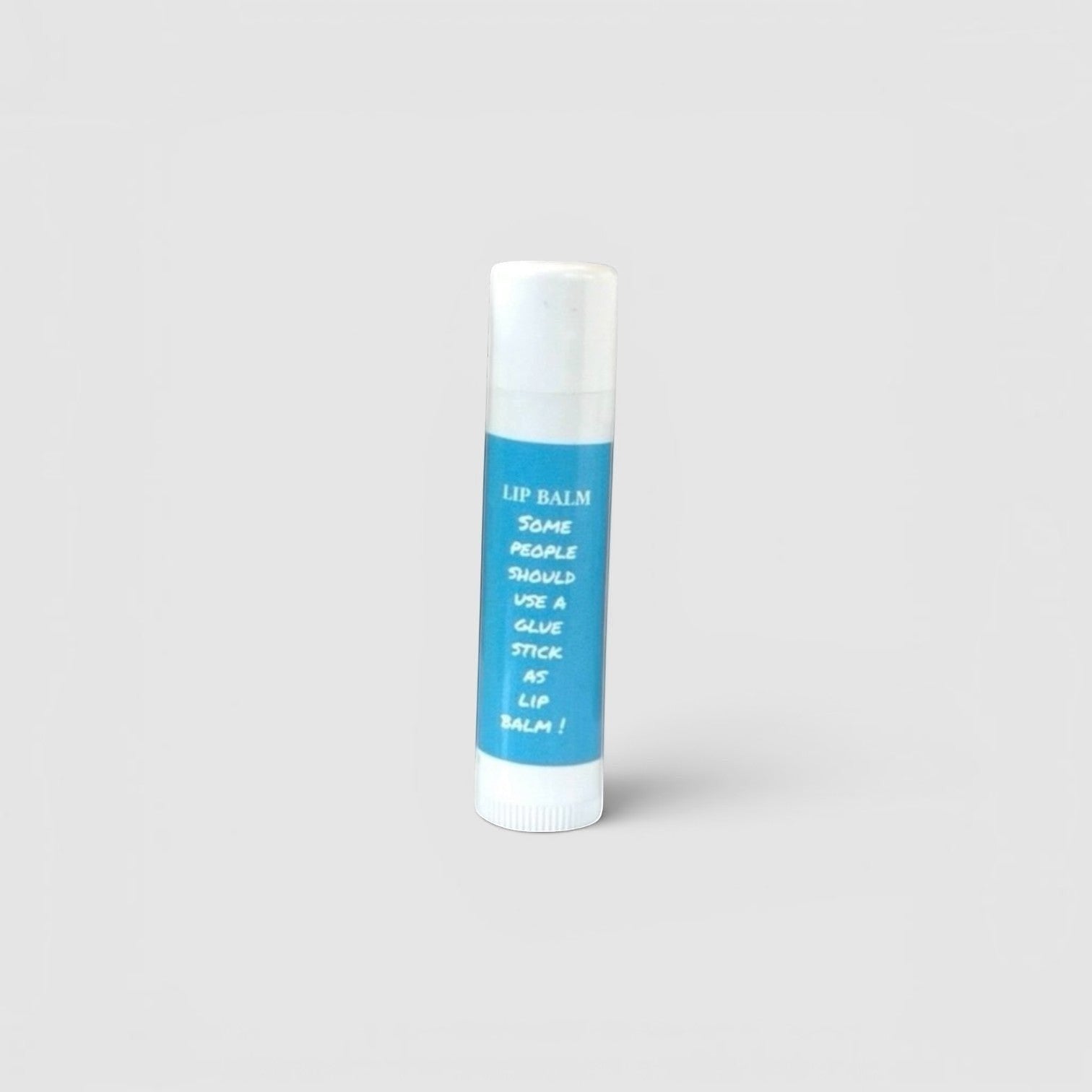 Harry’s Mama’s Faves: Lotions & Potions moisturizing lip balm in a blue tube with a humorous glue stick design.