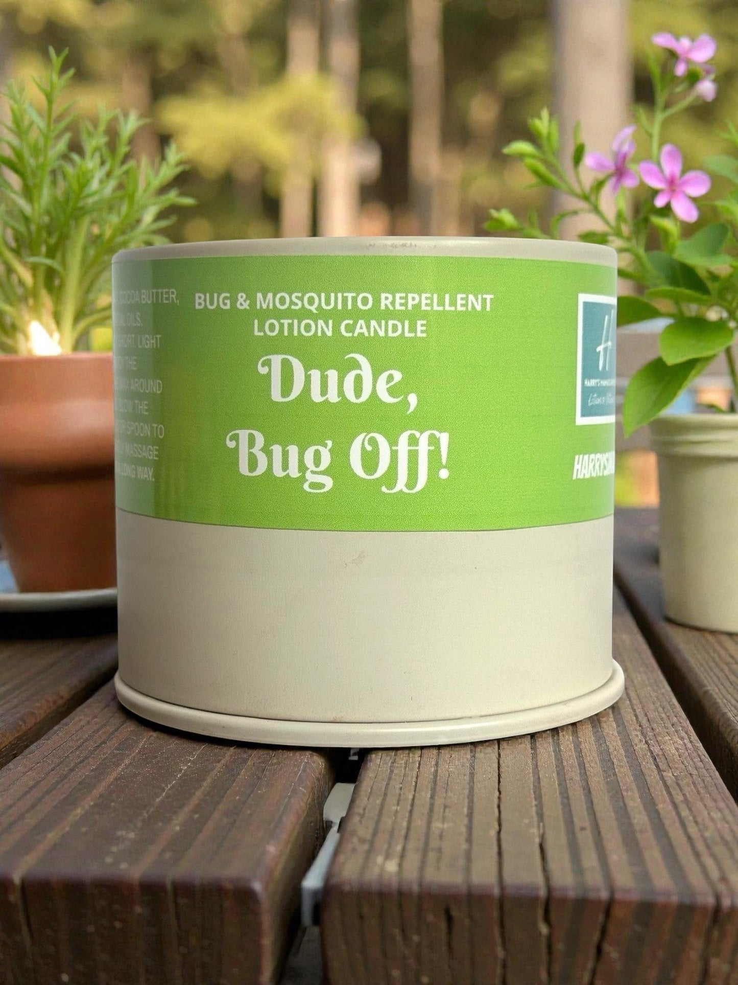 Harry’s Mama’s Faves: Lotions & Potions Dude, Bug Off! insect repellent lotion candle in a green and cream tin.