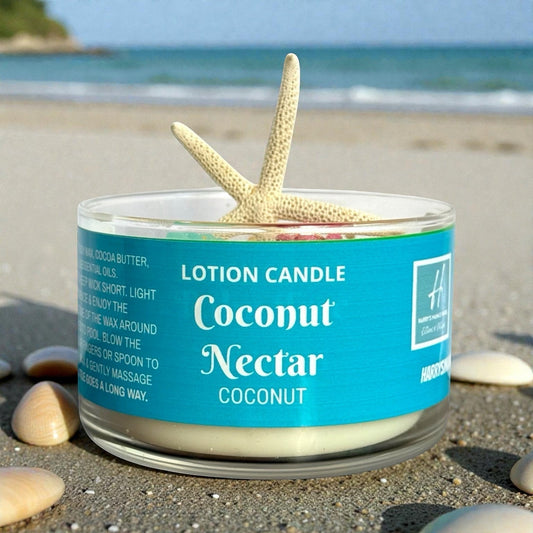 Harry’s Mama’s Faves: Lotions & Potions Coconut Nectar lotion candle with starfish and seashell wax embeds on sand.