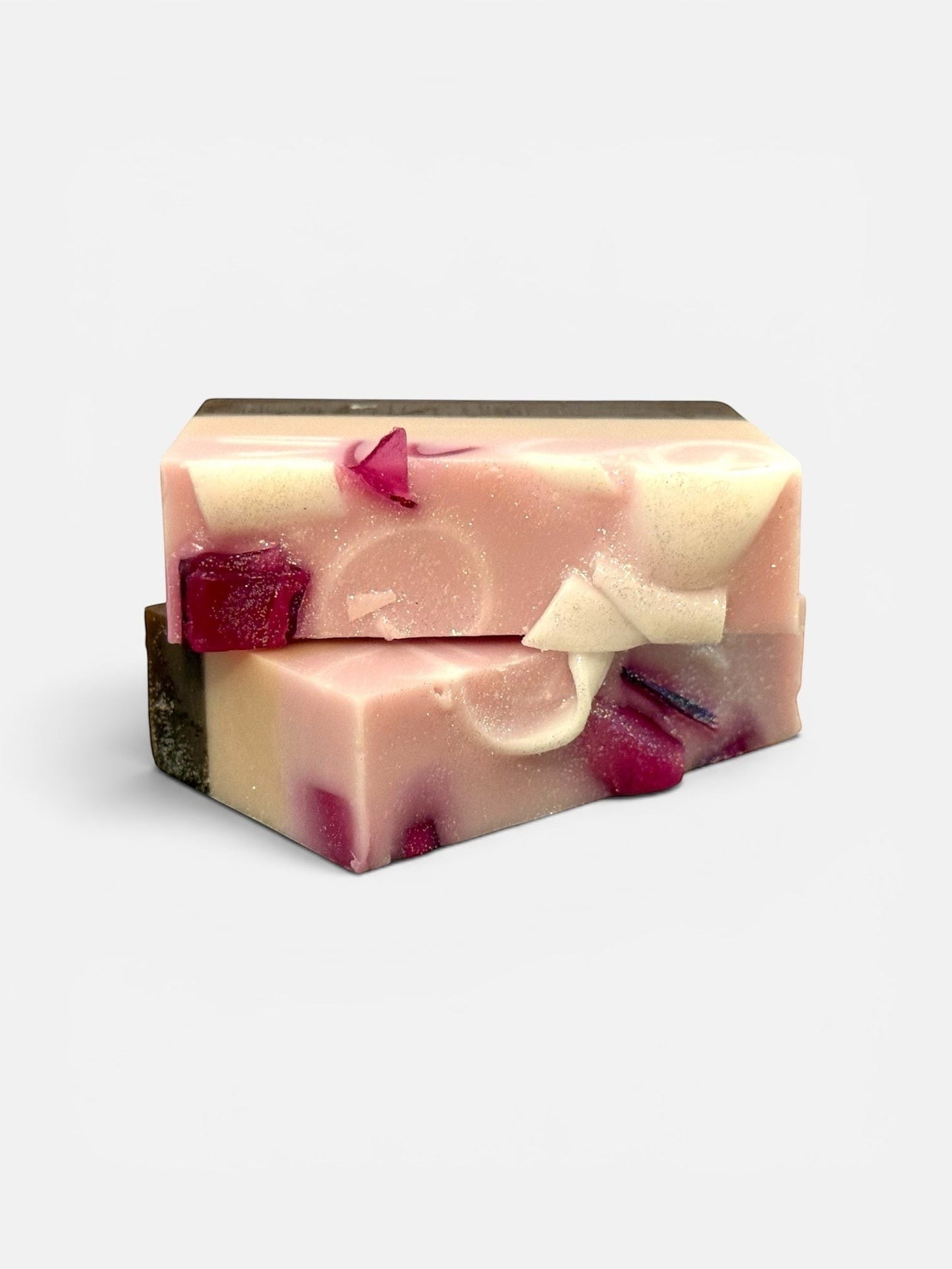Harry’s Mama’s Faves: Lotions & Potions handmade bar soap with pink and white swirls and embedded fig fruit pieces.