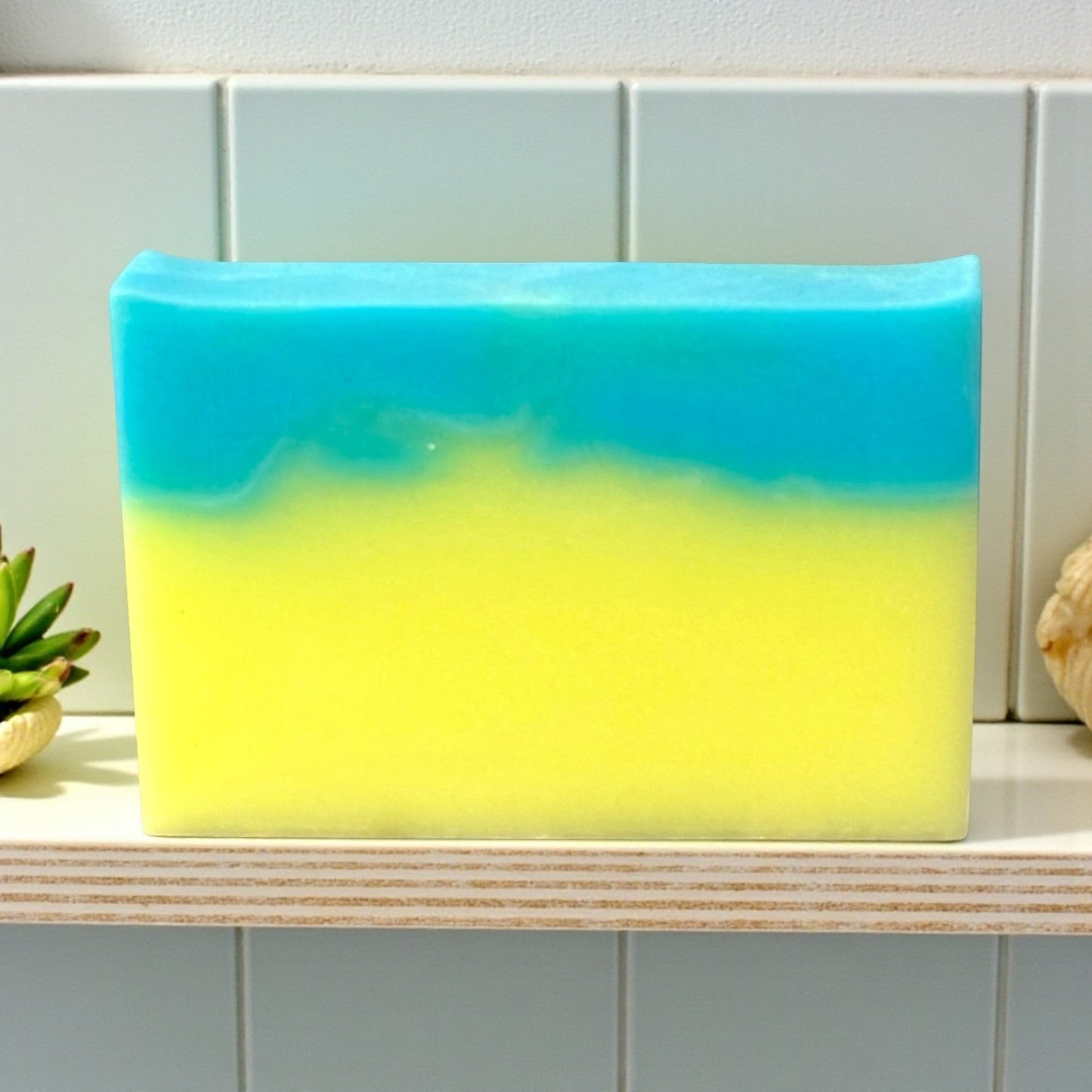 Harry’s Mama’s Faves: Lotions & Potions Hawaiian Coconut artisan bar soap with vibrant blue and yellow layers.