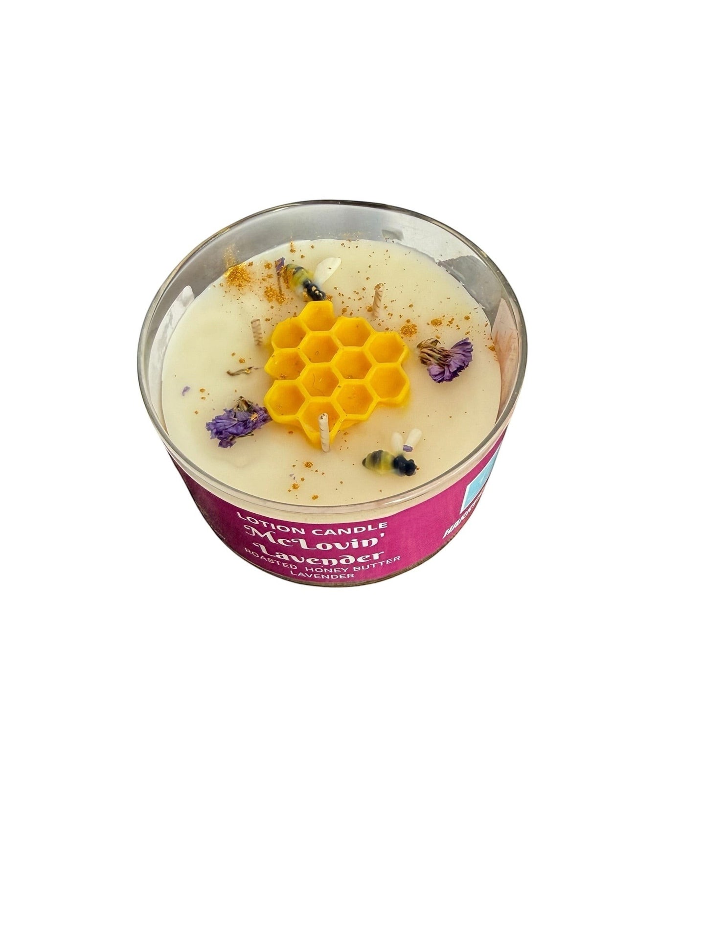 Harry’s Mama’s Faves: Lotions & Potions McLovin' Lavender lotion candle with honeycomb wax topper and dried flowers.