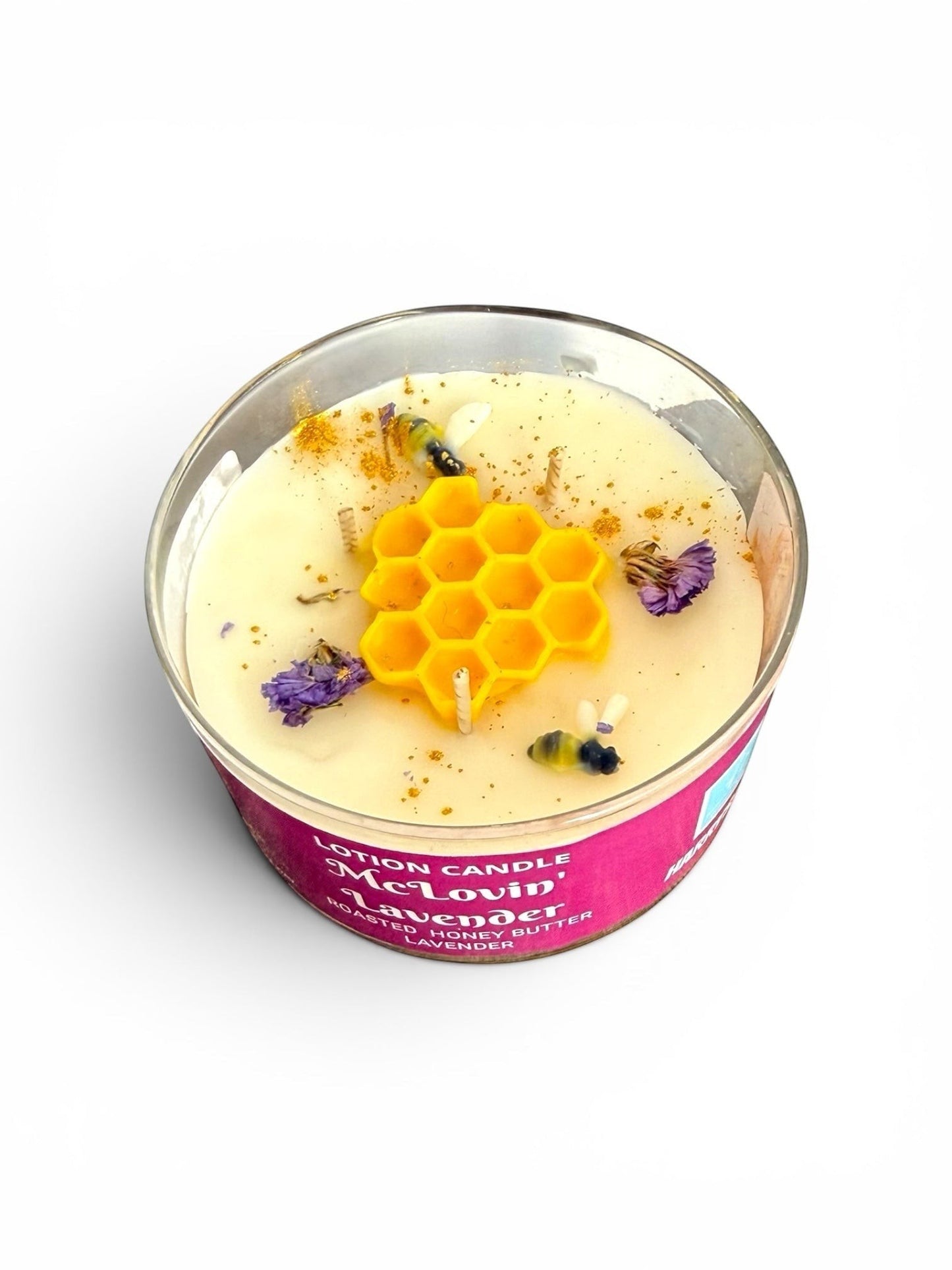 Harry’s Mama’s Faves: Lotions & Potions McLovin' Lavender lotion candle with honeycomb wax topper and dried flowers.