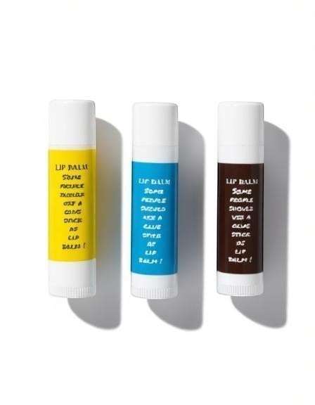 Harry’s Mama’s Faves: Lotions & Potions moisturizing lip balm trio in yellow, blue, and brown glue stick tubes.