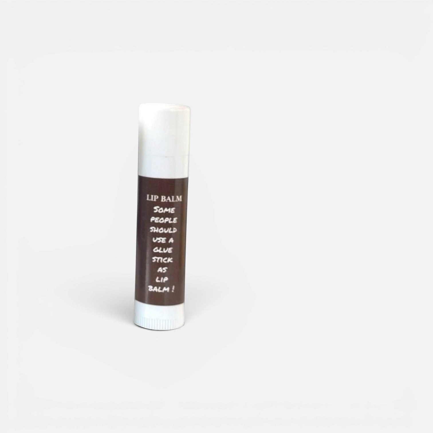 Harry’s Mama’s Faves: Lotions & Potions moisturizing lip balm in a white tube with humorous glue stick label design