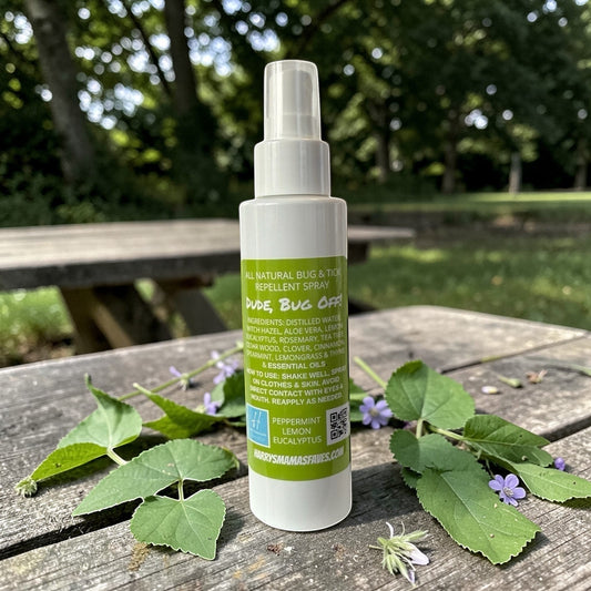 Harry’s Mama’s Faves: Lotions & Potions Dude Bug Off natural repellent spray bottle on a wooden table with leaves.