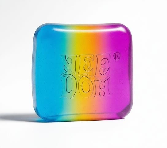 Harry’s Mama’s Faves: Lotions & Potions Nee Doh Nice Cube sensory fidget toy with a vibrant rainbow gradient design.
