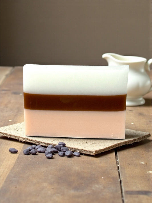 Harry’s Mama’s Faves: Lotions & Potions handmade sandalwood patchouli bar soap with white, brown, and peach layers.